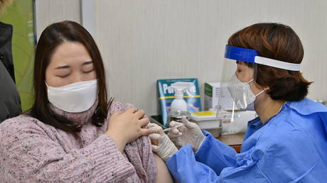 A nursing home worker in Seoul is shown last week receiving South Korea's first Covid-19 vaccination shot.