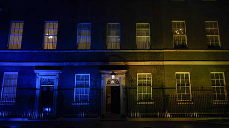 The facade of 10 Downing Street is lit up with the colors of Ukraine's flag, in London, Britain on February 24, 2022.